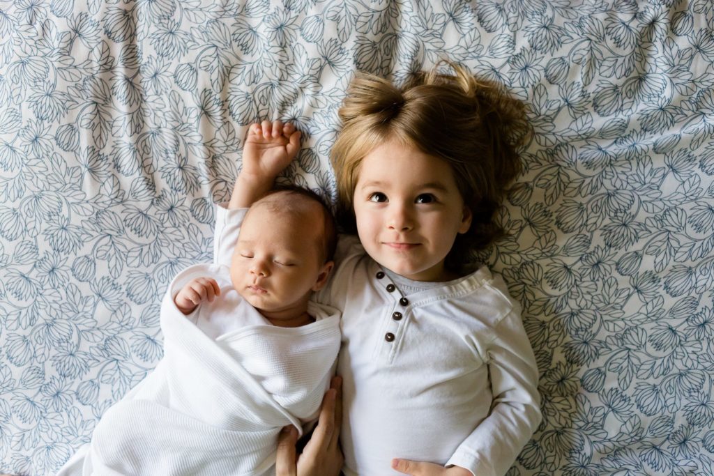 5 Things to Consider Before Starting a Family 5 a person holding a baby