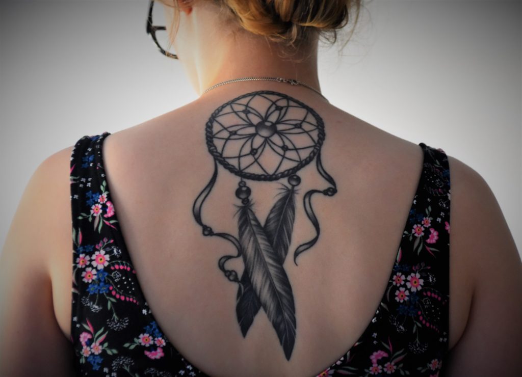 Common Tattoo Removal Pricing Guidelines 2 a woman with tattoo on her chest