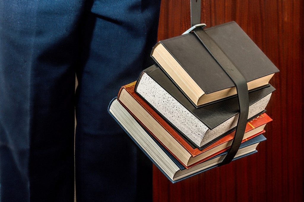 Should You Go Back to School in Your 20s or 30s? Here Are Your Options 19 a stack of books
