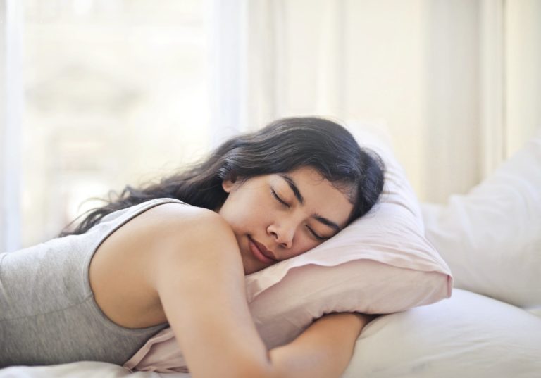 a woman lying on a bed