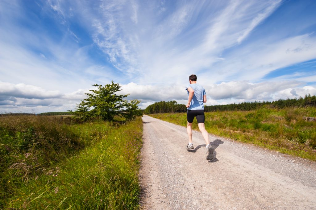 a man walking on a road