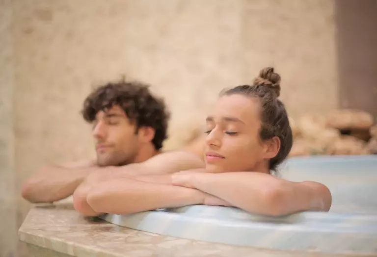 a man and woman in a bathtub