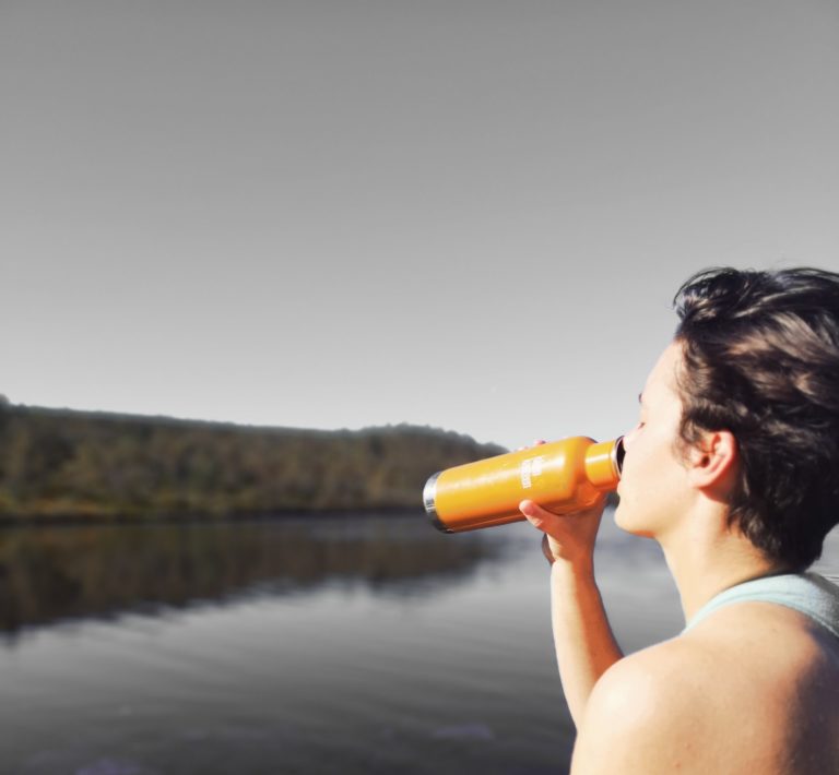 a person drinking from a glass