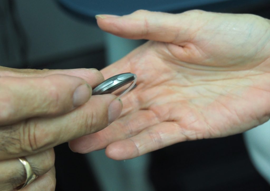 a close-up of a person holding a pen