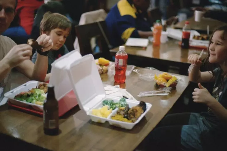 people eating pizza at a restaurant