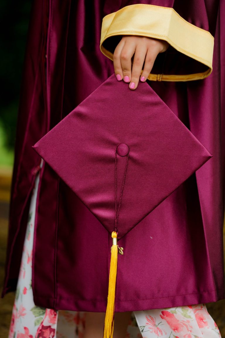 a person holding a pink umbrella