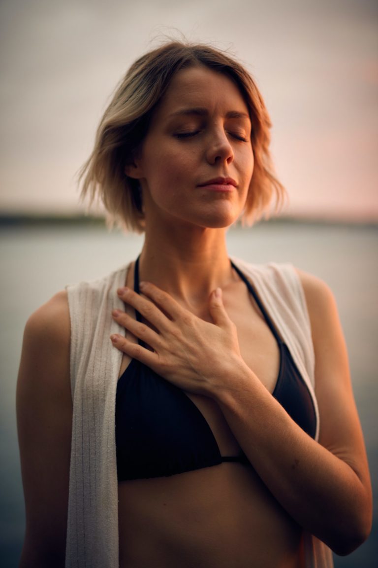 a woman with her hand on her chin