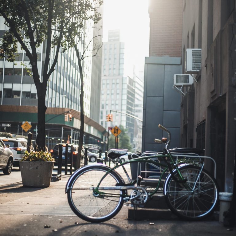 a bicycle parked on the side of a street